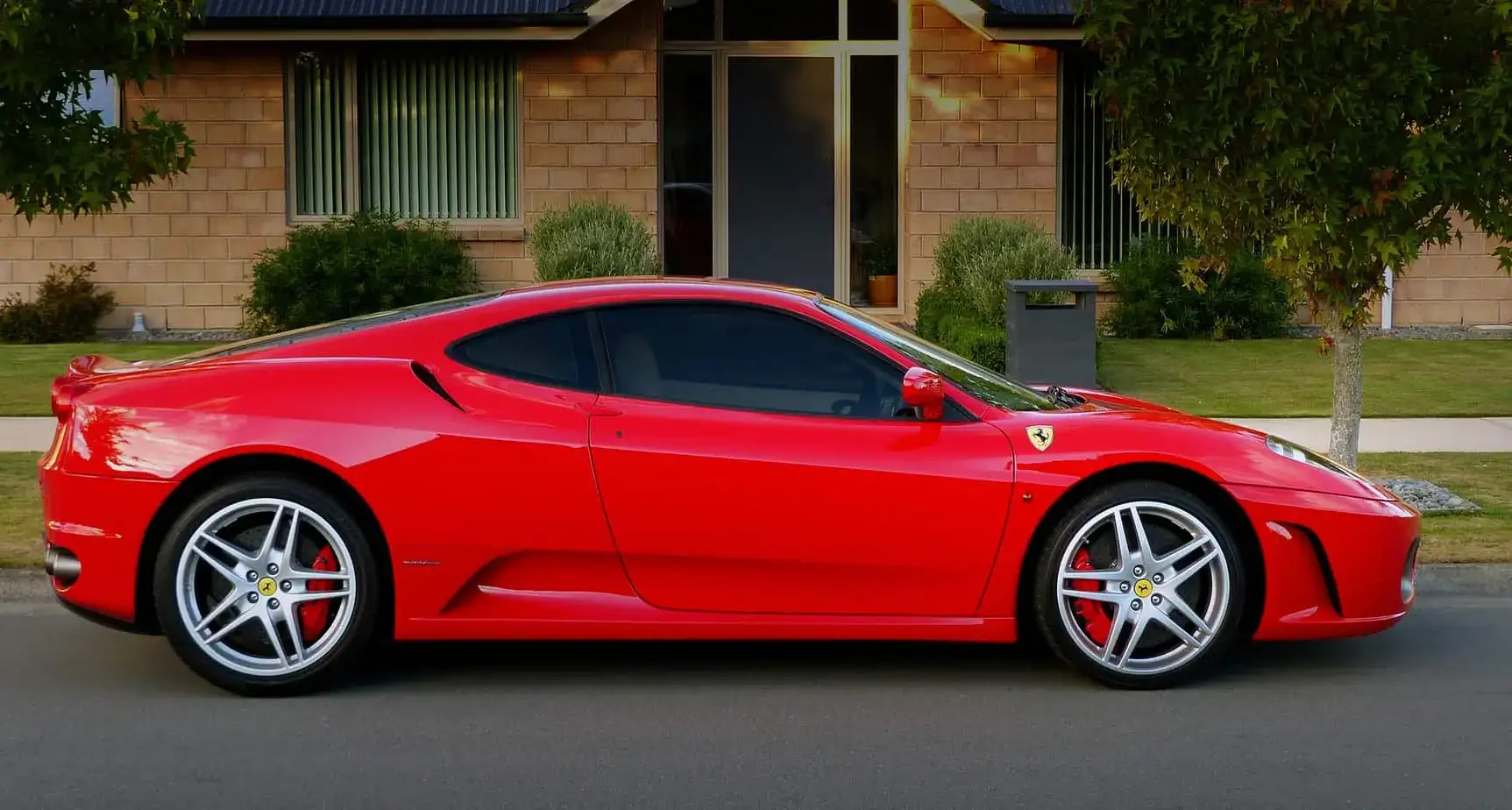 Regina exotic car on flatbed soft-strap transport