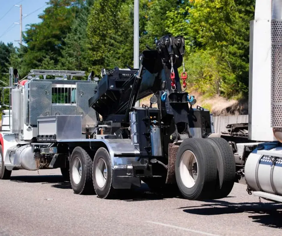 heavy-duty wrecker on a Pilot Butte highway shoulder